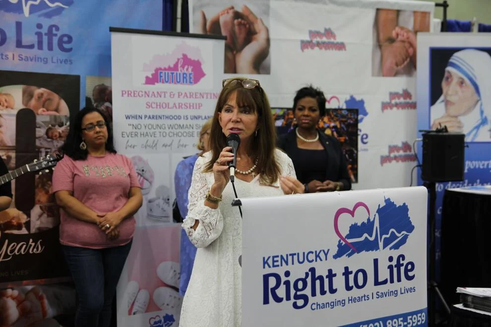 A woman is speaking at the kentucky right to life rally.