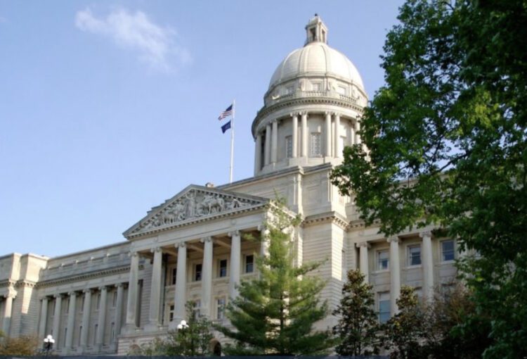 A large building with trees in front of it